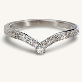 Hand engraved diamond solitaire platinum wishbone  ring with floral orange blossom flowers and leaves around the band