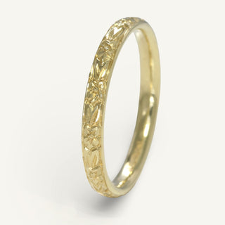 18ct gold slim court wedding band with hand engraved orange blossom pattern