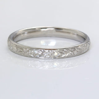 Platinum court wedding band with hand engraved orange blossom pattern