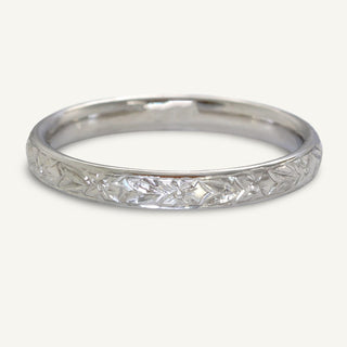 Platinum court wedding band with hand engraved orange blossom pattern