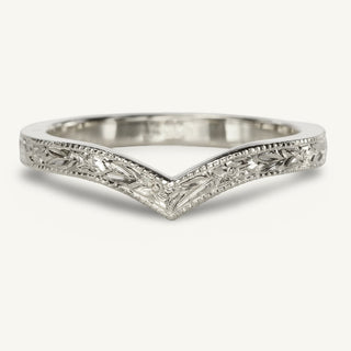 Platinum wishbone wedding ring with hand engraved floral orange blossom pattern around the band, framed by a milgrain border