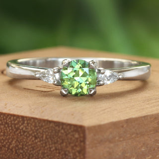 Green sapphire and pear cut diamond trilogy engagement ring, handmade in solid 950 platinum