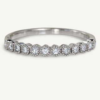 Handmade 950 platinum half eternity or wedding band with twelve natural diamonds set in milgrain engraved settings