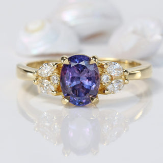 18ct gold oval purple sapphire engagement ring with diamond accents