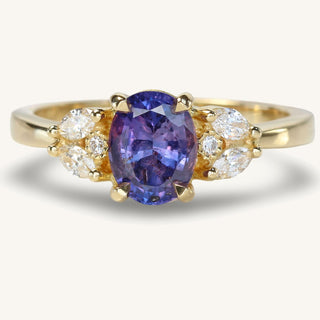 Handmade 18ct gold oval purple sapphire engagement ring with diamond accents