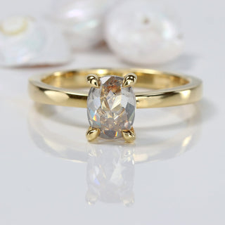 18ct gold oval cut salt and pepper diamond solitaire engagement ring on grey background