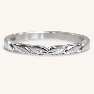 Slim platinum wedding ring with leaves hand carved into the metal. Handmade in our studio in Cornwall