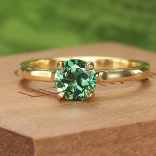Green sapphire solitaire engagement ring in 18ct gold