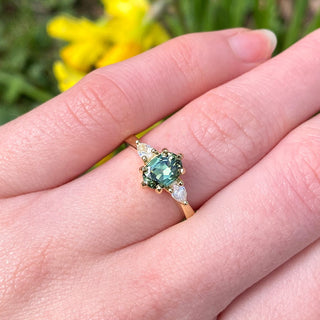 Veryan Parti sapphire and diamond trilogy engagement ring worn on the hand