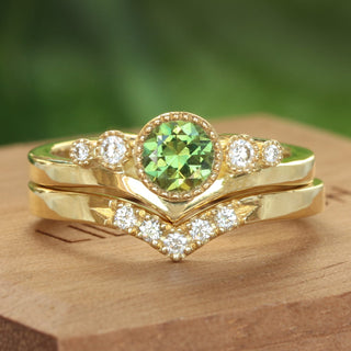 18ct gold fair trade green sapphire and diamond trilogy engagement ring and pave diamond wishbone wedding band