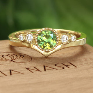 18ct gold fair trade green sapphire and diamond trilogy engagement ring handmade by goldsmith Lilia Nash
