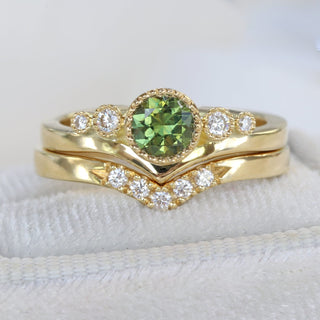 Green sapphire and diamond wishbone engagement ring presented in a handmade ring box.