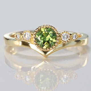 18ct gold green sapphire and diamond wishbone engagement ring 