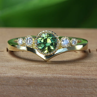 18ct gold fair trade green sapphire and diamond trilogy engagement ring handmade by goldsmith Lilia Nash