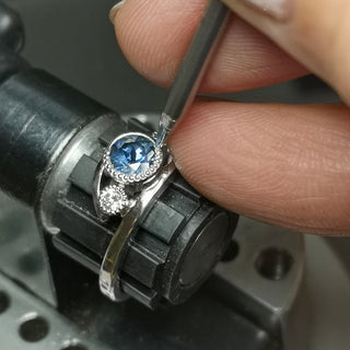 Lilia Nash hand-making a platinum sapphire and diamond engagement ring, with traditional jewellery making methods.