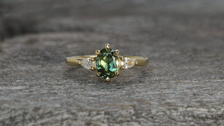 18ct gold green sapphire and diamond trilogy engagement ring