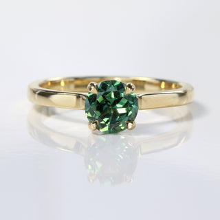 Handmade 18ct gold Parti sapphire solitaire engagement ring with teal and green tones.