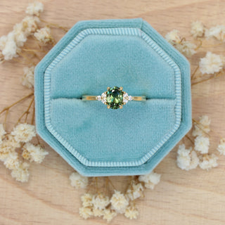 Handmade ‘Ennys’ Parti sapphire and diamond engagement ring presented in a blue hexagonal ring box.
