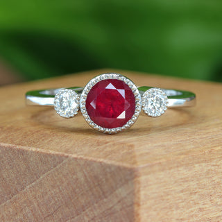 Ruby engagement ring on wooden display