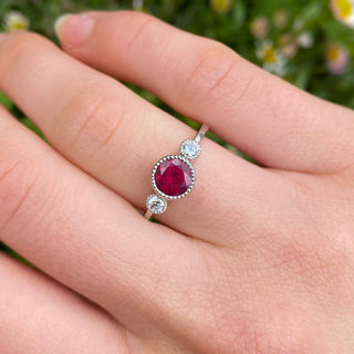 Ruby ring shown on hand in natural light