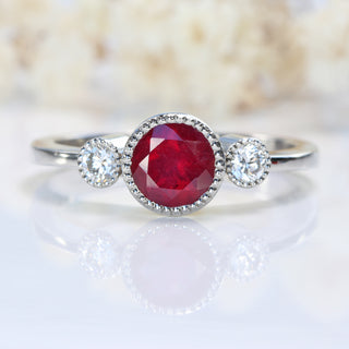 Trio of stones on platinum band showing ruby and diamonds