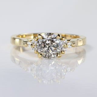 18ct gold salt and pepper diamond cluster engagement ring on reflective surface.