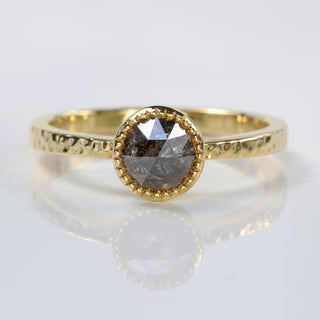 Handmade 18ct gold salt and pepper diamond solitaire ring with hammered band and milgrain bezel.
