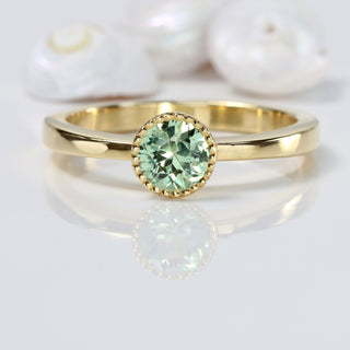 Green sapphire solitaire engagement ring handmade from 18ct gold