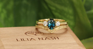 18ct gold ceep teal sapphire and diamond trilogy engagement ring and orange blossom engraved wishbone wedding band