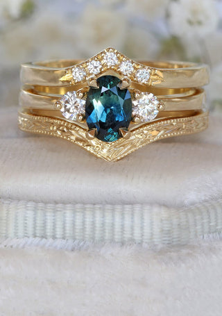 18ct gold oval teal sapphire and diamond trilogy engagement ring with pave diamond wishbone band and orange blossom engraved wishbone wedding ring