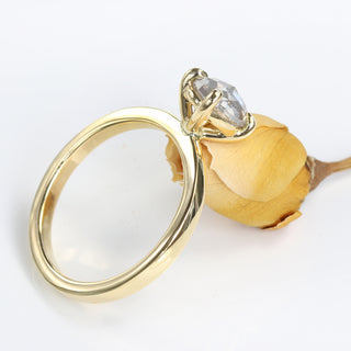 Side profile of 18ct gold oval salt and pepper diamond engagement ring.