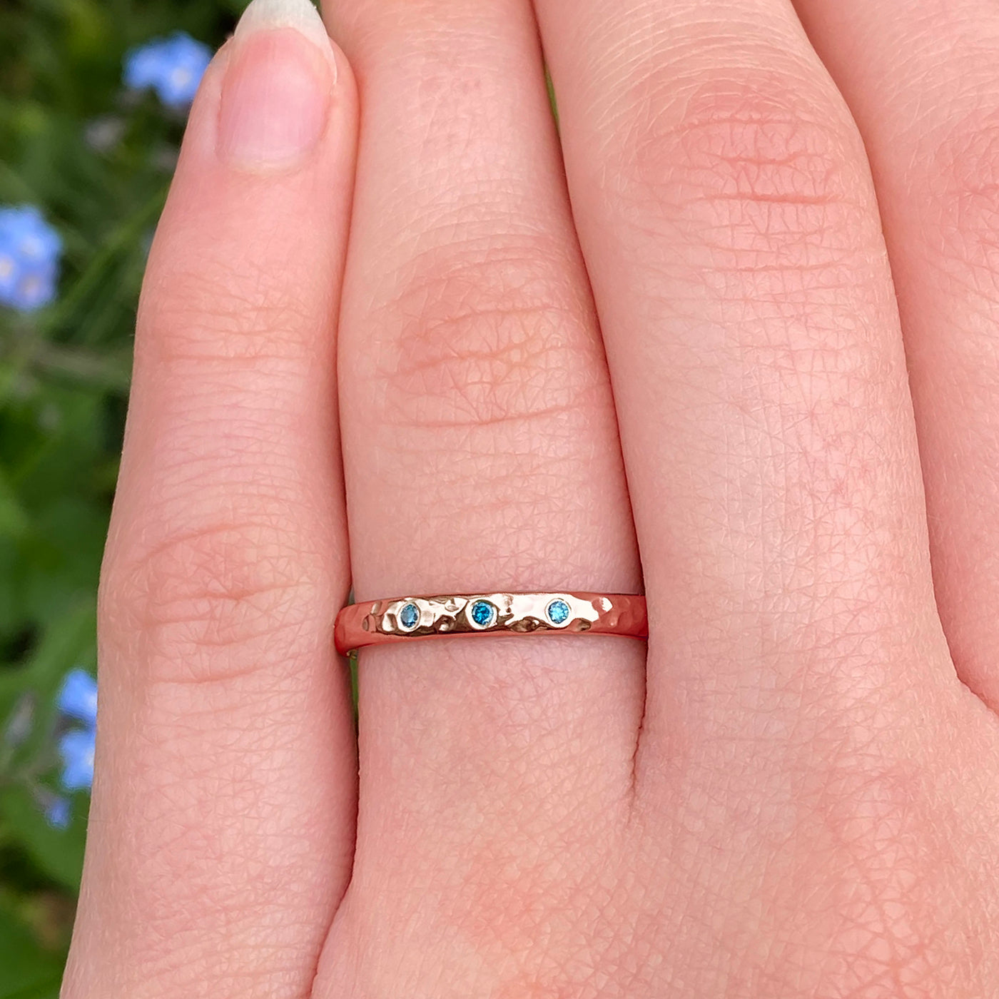 Rose gold with store blue diamond