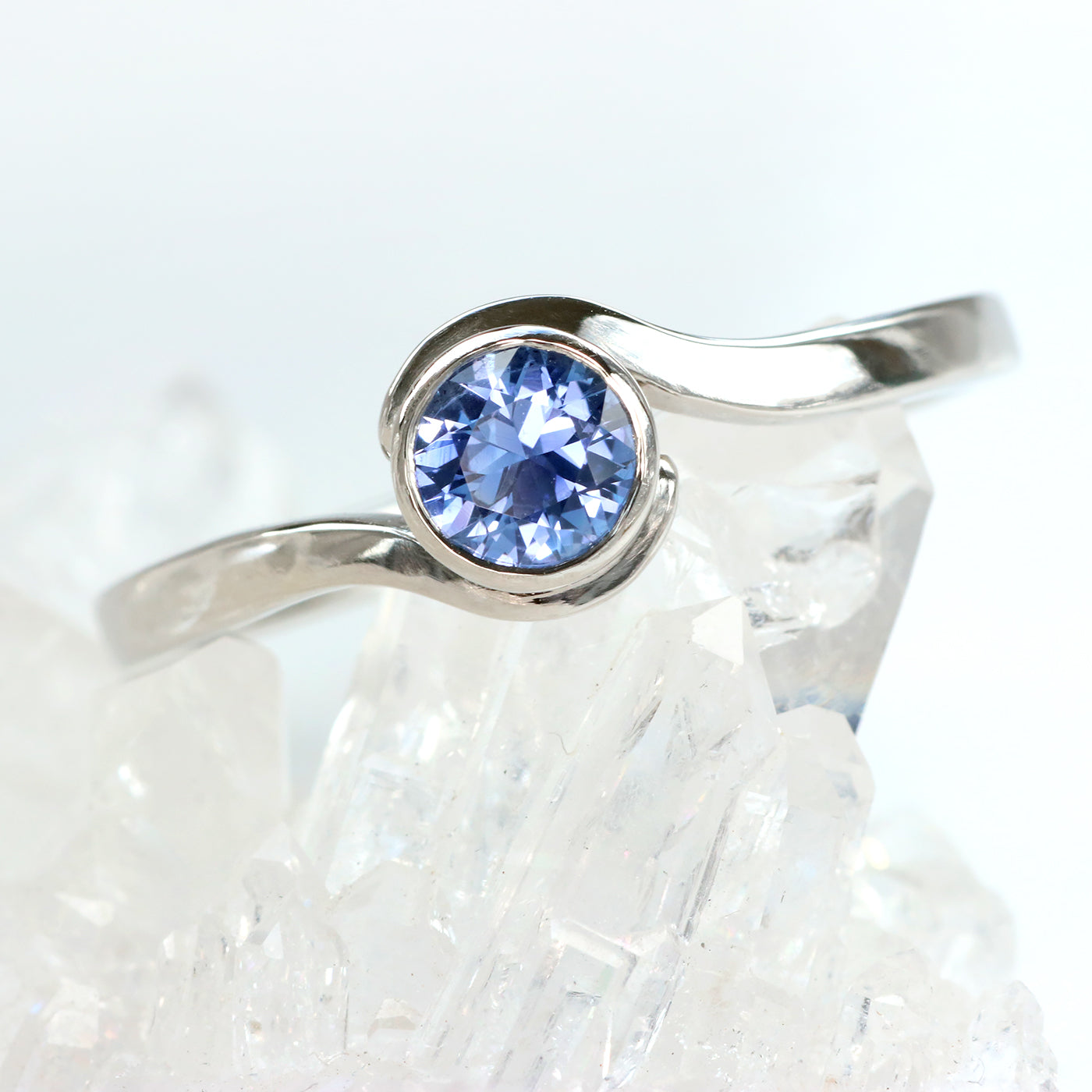 Platinum Blue Sapphire Swirl Solitaire Engagement Ring