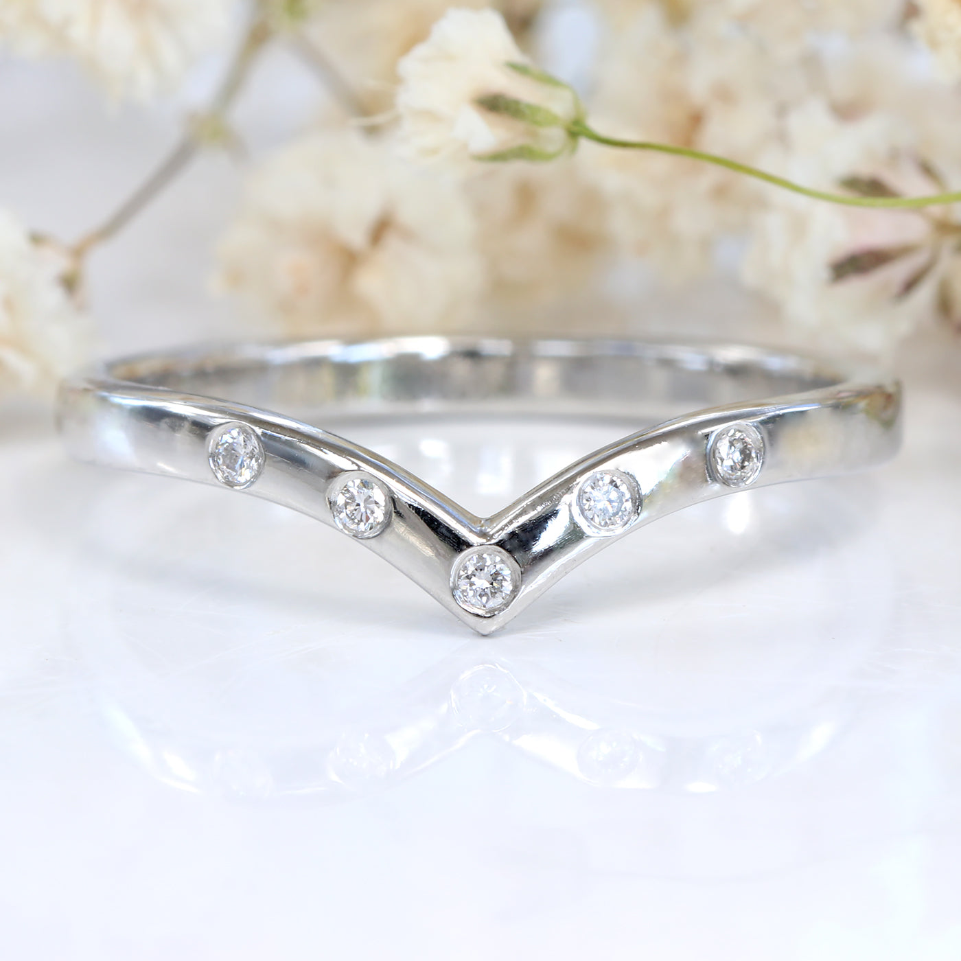 Diamond wishbone clearance ring