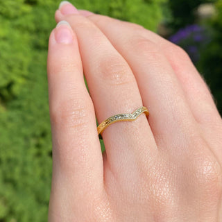 Gold Wishbone Ring with textured pattern shown on finger