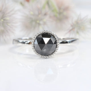 Close up of rose cut black diamond solitaire engagement ring in platinum