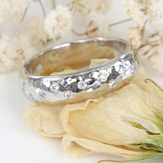 Chunky 6mm wide hammered platinum wedding or eternity ring with 10 diamonds set at the front of the band