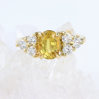 Bespoke oval yellow sapphire and diamond cluster engagement ring handmade in UK.