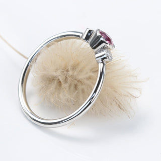 Side profile of platinum pink sapphire trilogy engagement ring showing slim 1.5mm band.