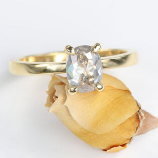 Front view of oval salt and pepper diamond solitaire ring in 18ct gold.