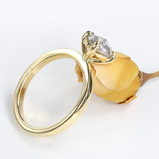 Side profile of 18ct gold oval salt and pepper diamond engagement ring.