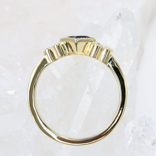Side profile of the Princess cut blue sapphire ring.