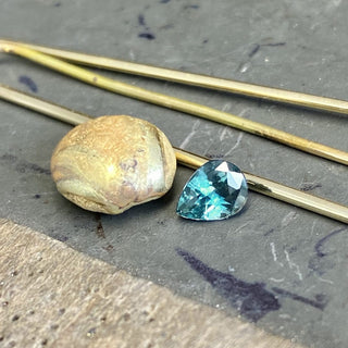 Custom Teal Sapphire and Diamond Halo Engagement Ring in 18ct Gold