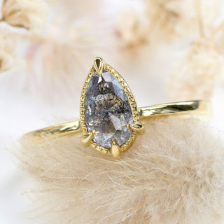 Front view of pear cut salt and pepper diamond solitaire engagement ring