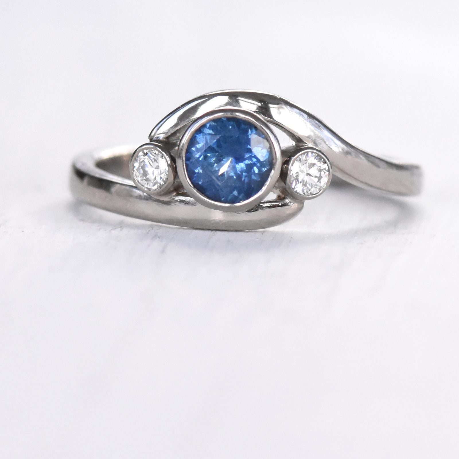 blue sapphire and diamond wave ring