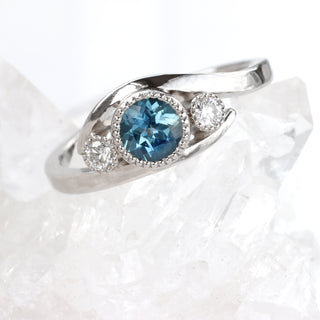 Custom Platinum Blue Sapphire and Diamond Wave Trilogy Ring