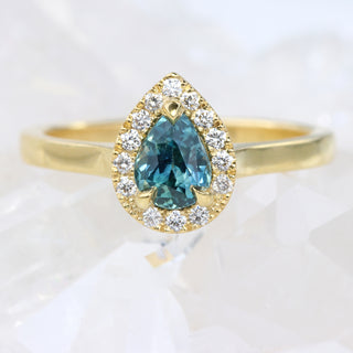 Custom Teal Sapphire and Diamond Halo Engagement Ring in 18ct Gold