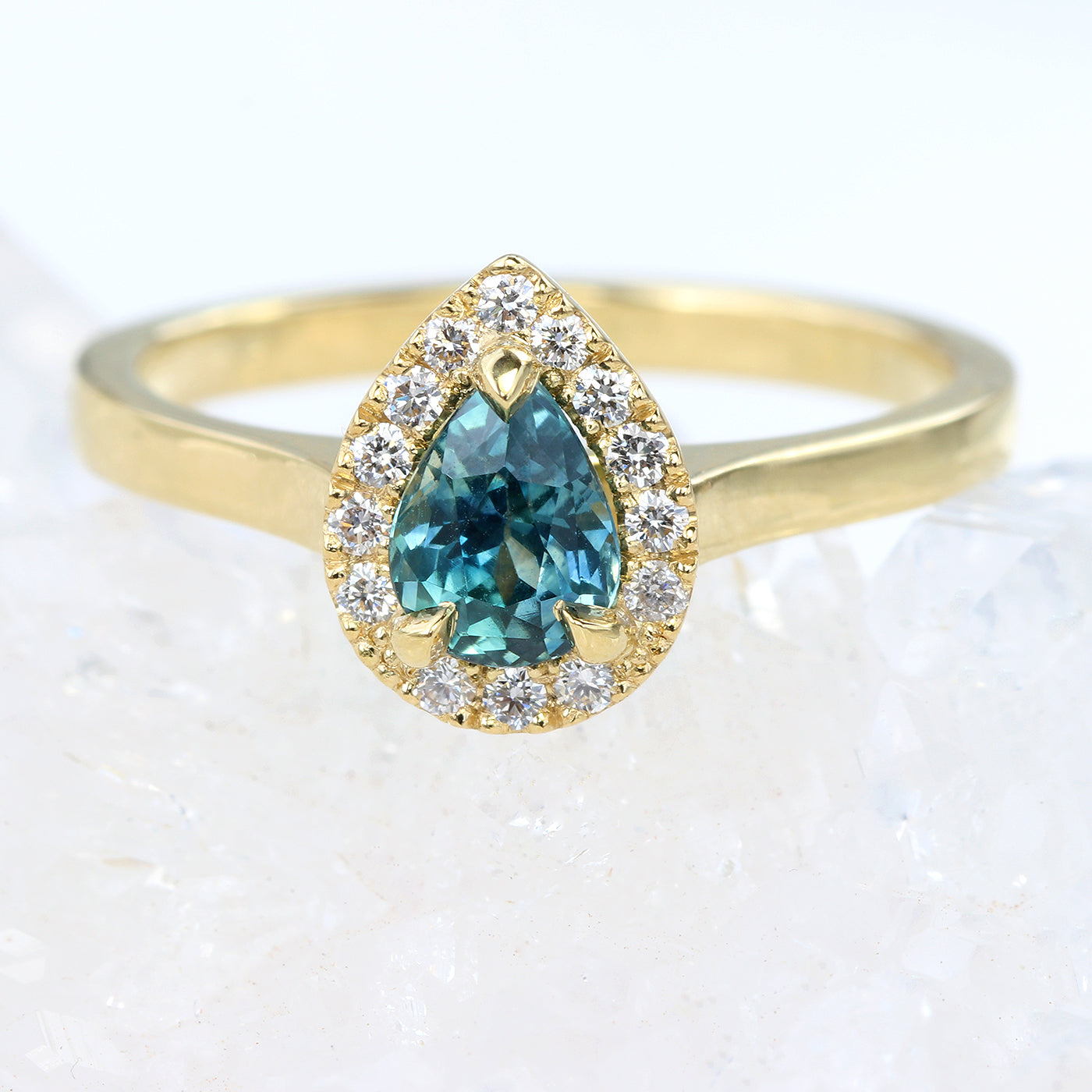 Teal Sapphire and Diamond Halo Engagement Ring in 18ct Gold