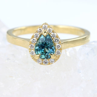 Custom Teal Sapphire and Diamond Halo Engagement Ring in 18ct Gold
