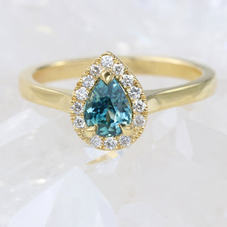 Custom Teal Sapphire and Diamond Halo Engagement Ring in 18ct Gold